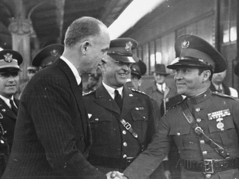 thomas D mcavoy colonel fulgencio batista shaking hands with sumner welles while general malin craig stands aside